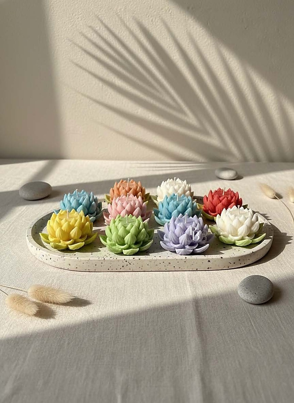 Lotus flower candles lined up on a long tray, handmade soy wax, Pink Blossom bulk order