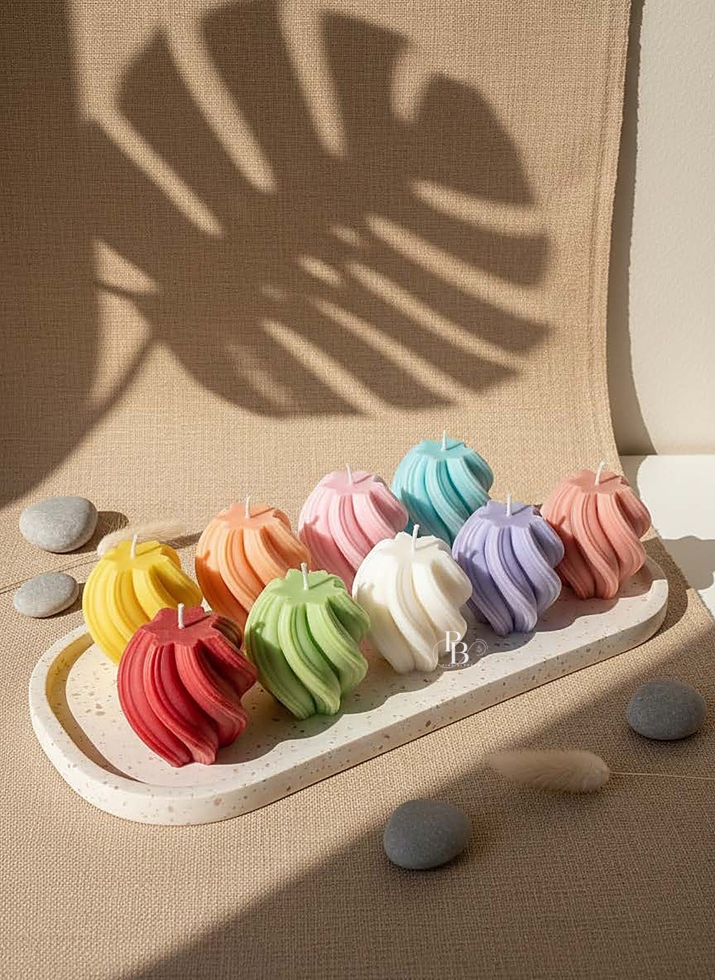 Wavy swirl pillar candles in rows on an oval tray, handmade soy wax, Pink Blossom bulk order