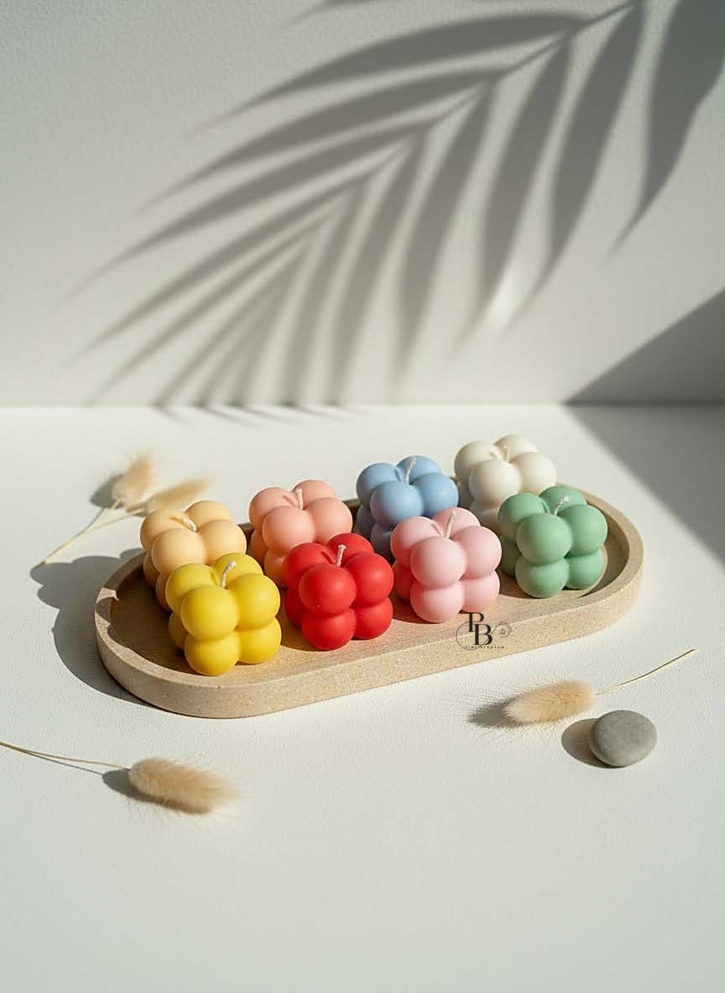 Mini bubble candles lined up on a wooden tray, handmade soy wax, Pink Blossom bulk order