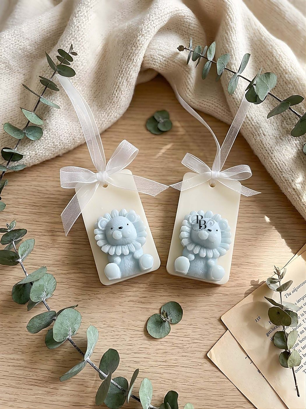 Wax sachets with blue lion cub reliefs tied with white ribbon, handmade soy wax, Pink Blossom bulk order
