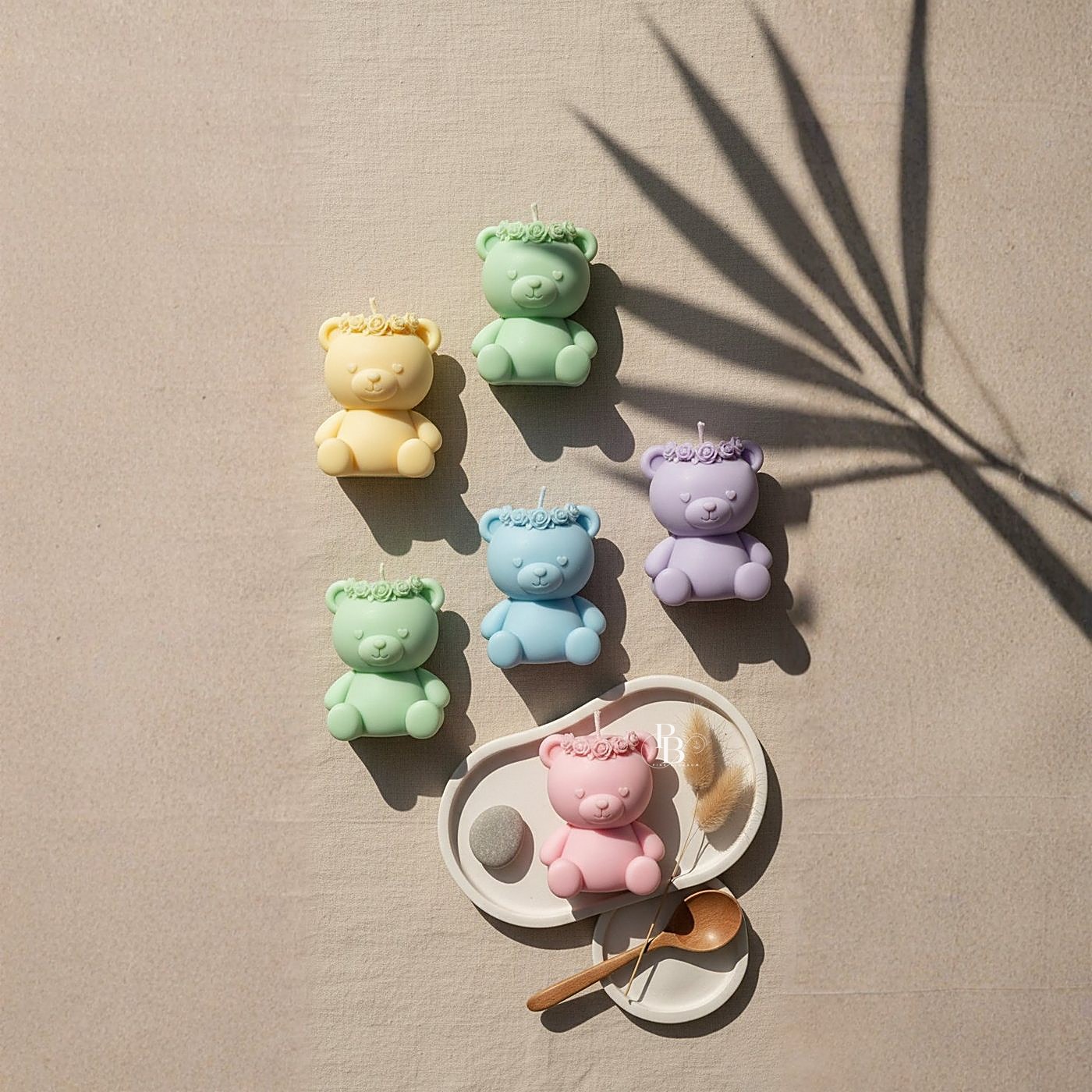 Small pastel teddy bear candles on a beige surface, handmade soy wax, Pink Blossom bulk order